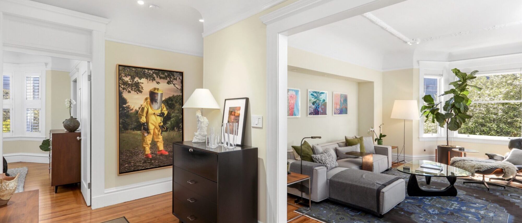 Entry hall opening to the living room with bay windows at 2696 Bush Street, San Francisco